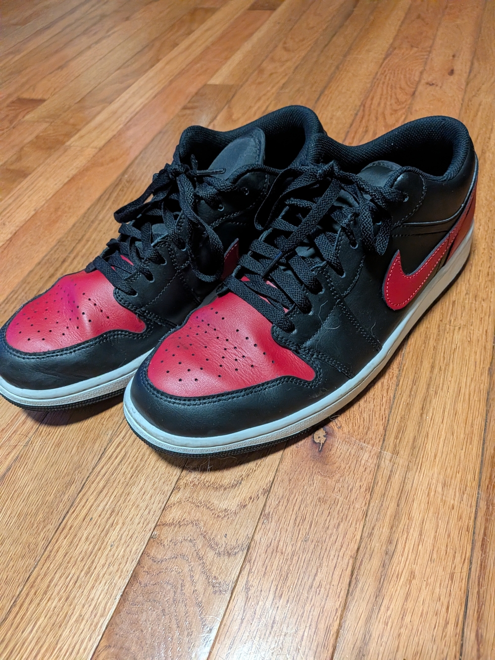 Authentic Nike Jordan 1 Men’s Black and Red Low Top Sneakers with Red Swoosh